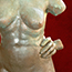 Sculpture of female torso with hands on hips