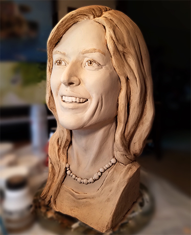 Bust of a smiling woman