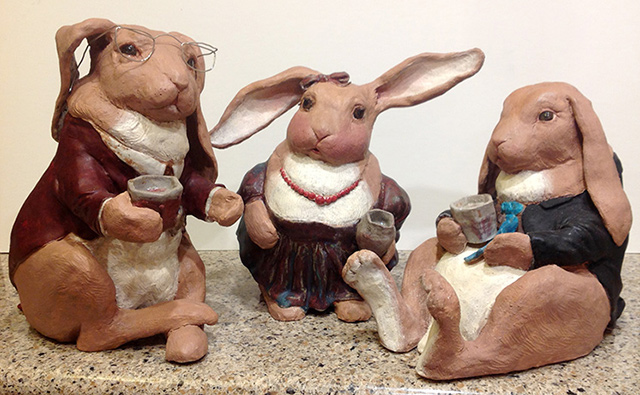 Sculpture of rabbits in clothes