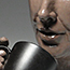 Sculpture of a face and coffee cup