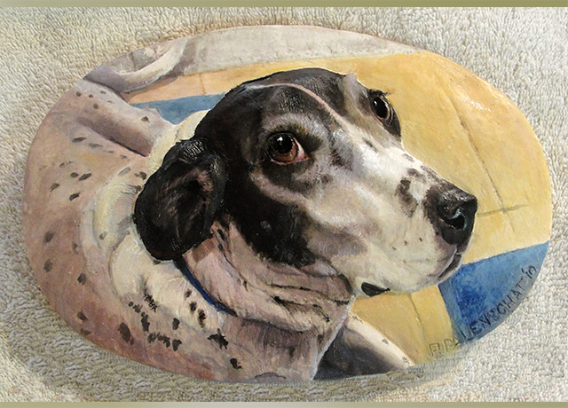 Sculpture relief of a spotted dog