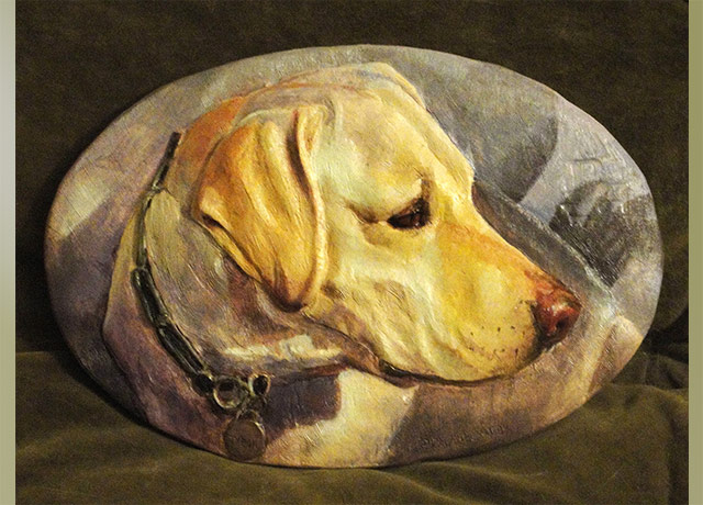 Sculpture Relief of a yellow dog
